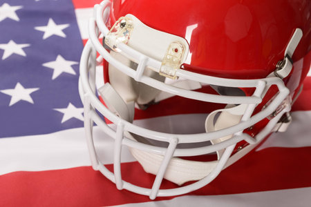 Red American Football Helmet On American Flagの写真素材