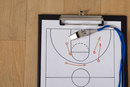 Close-up Of Clipboard With Whistle And Sport Tactics On Paperの写真素材
