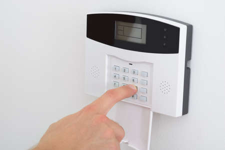Security Alarm Keypad With Person Arming The System