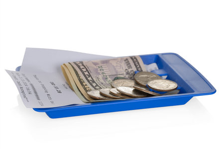 Close-up Of Shopping Receipt With American Dollars On White Backgroundの写真素材