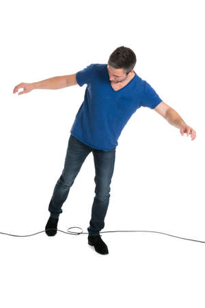 Man Stucked In Cable While Walking Over White Background