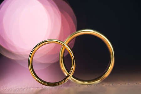 Close-up Photo Of Two Golden Wedding Rings