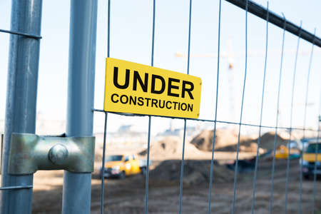 Photo Of Under Construction Sign On Gateの写真素材