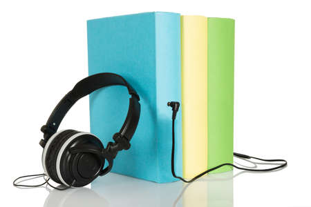 Three Audio Books With Headphone Over White Backgroundの写真素材