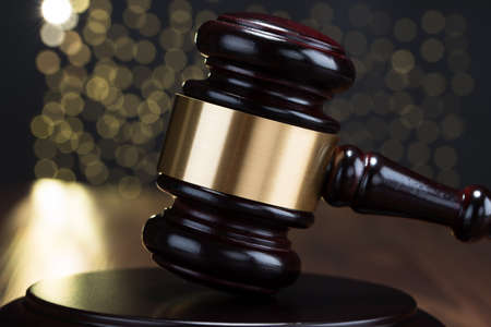 Close-up Of Brown Wooden Gavel With Bokeh Backgroundの写真素材