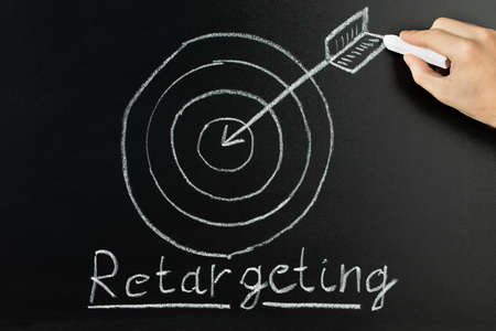 Hand Drawing Dart And Arrow With Retargeting Word On Blackboardの写真素材