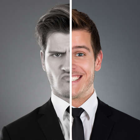 Portrait Of Businessman With Two Face Expressionの写真素材