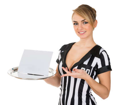 Young Attractive Female Referee Carrying Blank Card On Trayの写真素材