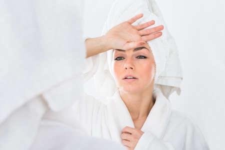 Close-up Of A Woman In Bathrobe Suffering From Fever