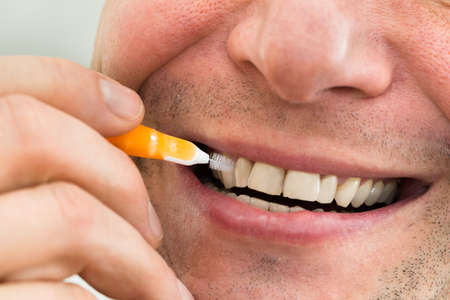 Close-up Of A Man Cleaning His Teeth