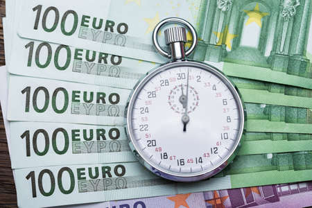 Close-up Of A Stopwatch On Euro Banknotesの写真素材