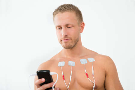 Portrait Young Man With Electrodes On Chestの写真素材
