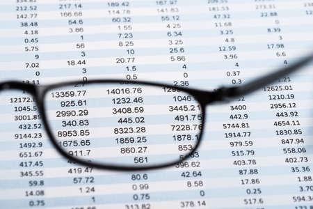 View Of Financial Document From Transparent Eyeglassesの写真素材