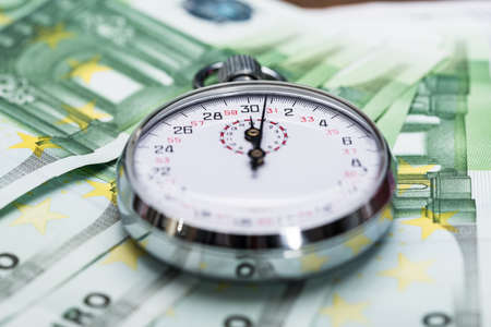 Close-up Of A Stopwatch On Euro Banknotesの写真素材