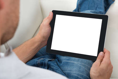 Close-up Of Person Holding Blank Screen Digital Tablet