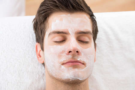 Face Mask Applied To A Young Man In A Spaの写真素材