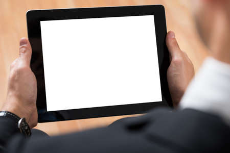Close-up Of Businessperson Using Digital Tablet With Blank Display