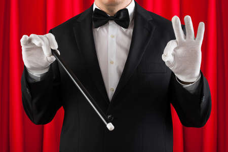 Close-up Of Magician Performing Magic With Magic Stickの写真素材