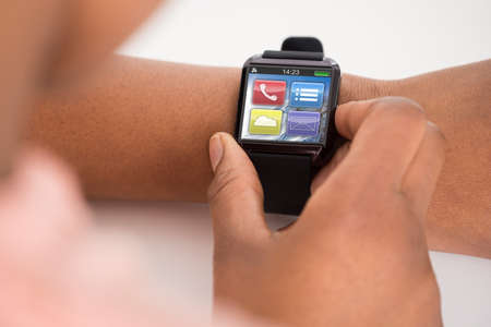 Close-up Photo Of Person's Hand Wearing Smartwatchの写真素材