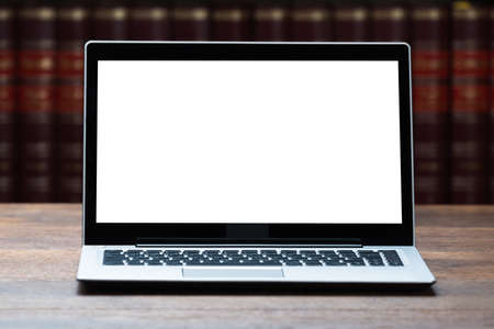 Closeup of laptop with blank screen on table in courtroomの写真素材