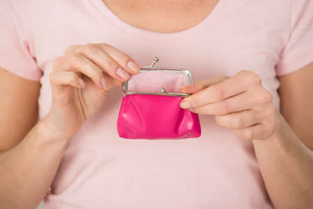 Close-up Photo Of Woman Holding Small Purseの写真素材