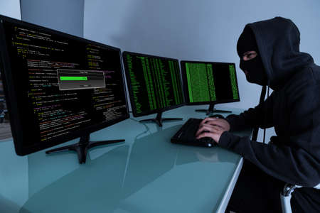 Hacker Stealing Data On Multiple Computers And Laptop