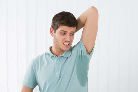 Man With Hyperhidrosis Sweating Very Badly Under Armpitの写真素材