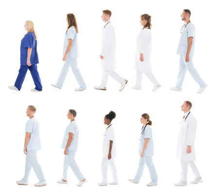 Collage Of Medical Team Walking In Row Against White Backgroundの写真素材