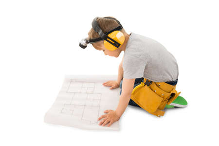 Cute Little Boy Looking At Blueprint Isolated On White Backgroundの写真素材