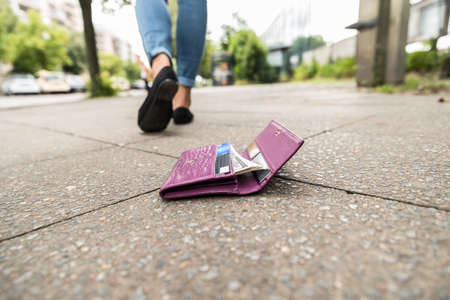 Woman Walking After Losing His Wallet On Streetの写真素材