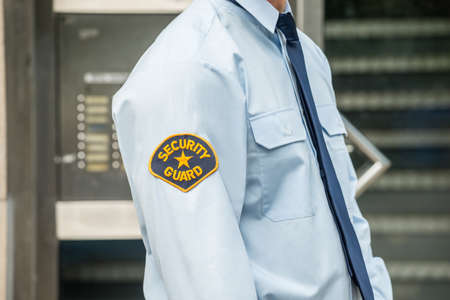 Close-up Photo Of Security Guard In Uniform