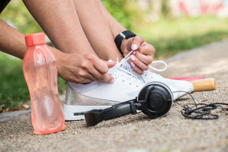 Female Runner Trying Running Shoes Getting Ready For Jogging