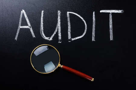 Close-up Of Audit Concept With Magnifying Glassの写真素材