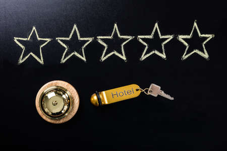 Five Star Service Concept  With Service Bell And Hotel Key On Blackboardの写真素材