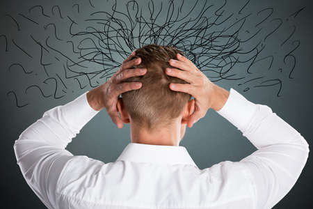 Worried Stressed Businessman By Indecision And Problemsの写真素材