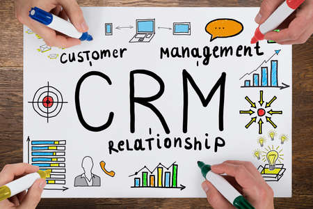 Group Of People Drawing Customer Relationship Concept On White Paper With Colorful Sketch Penの写真素材