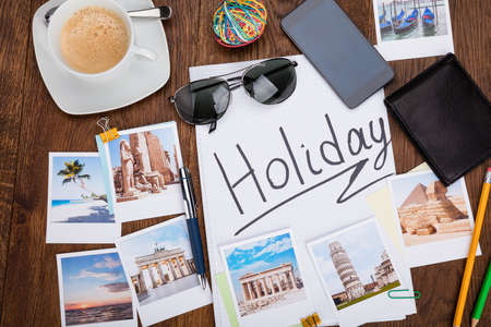 Photos Of Holiday On Wooden Desk With Sunglasses And Smartphone