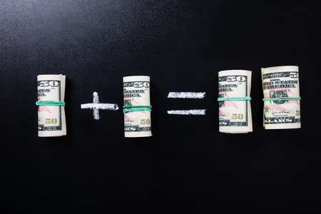 Close-up Of Money Saving Concept On Blackboardの写真素材