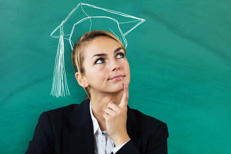Young Businesswoman Thinking Of Completing Education At Business Schoolの写真素材