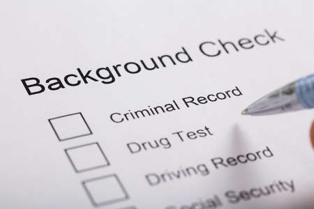 Close-up Of Pen Over Background Check Form
