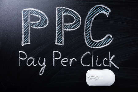 High Angle View Of Computer Mouse In Pay Per Click Textの写真素材