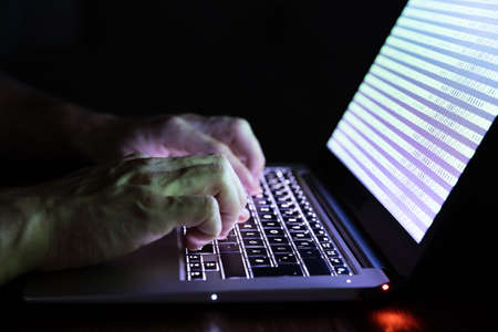 Close-up Of A Person's Hand Typing On Laptop