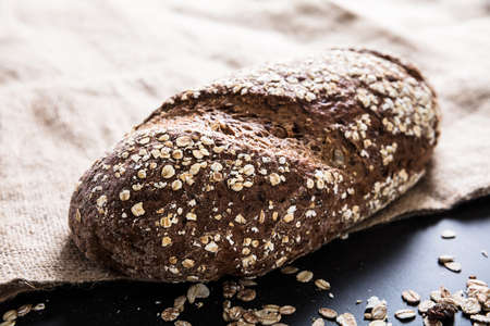 Close-up Of A Freshly Baked Cereal Bread On Sackの写真素材
