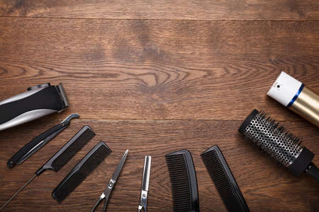 High Angle View Of A Hairdresser Tools Arranged On Wooden Deskの写真素材
