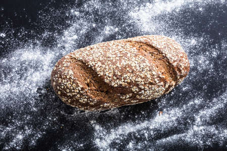 High Angle View Of A Freshly Baked Sliced Bread With Flourの写真素材