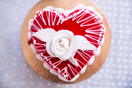 Cake In The Heart Of Shape With White Rose