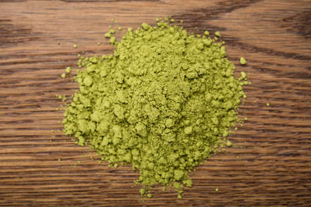 Photo Of Matcha Tea Powder On Wooden Tableの写真素材