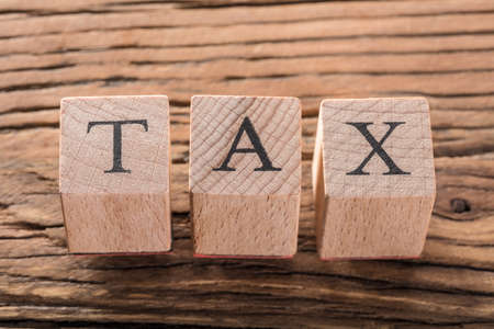 Elevated View Of Tax Blocks On Wooden Backgroundの写真素材