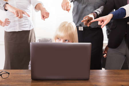 Many Hands Pointing The Stress Business Woman At The Workplaceの写真素材