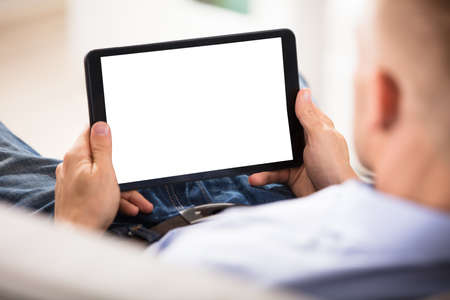 Close-up Of A Man Holding Digital Tablet With Blank White Screen